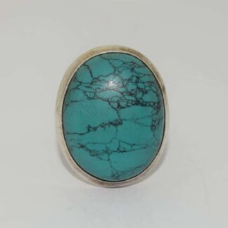 A Vintage And Very Large Turquoise Stone Silver Ring